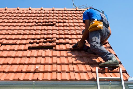 Roof Tile Repair The Roof Man Carindale Licensed roofing contractor replacing concrete tiles in Carindale QLD