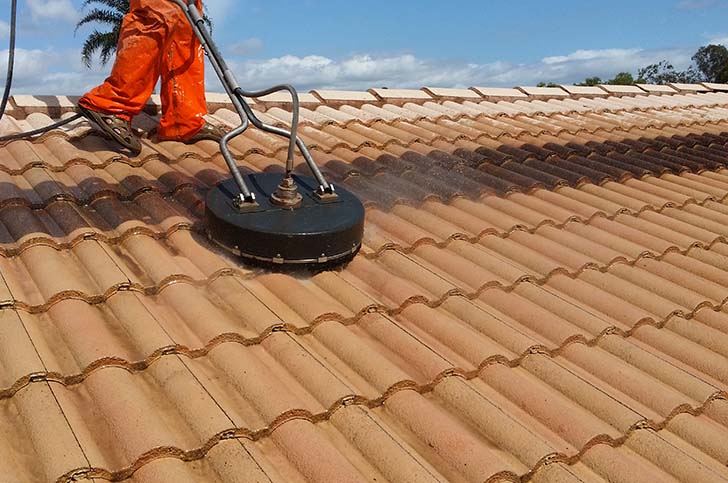 Roof Pressure Cleaning in process on light brown roof